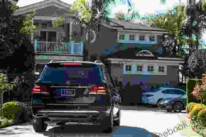 A Black Car Parked In A Driveway. Colors Of Cars: Basic Colors