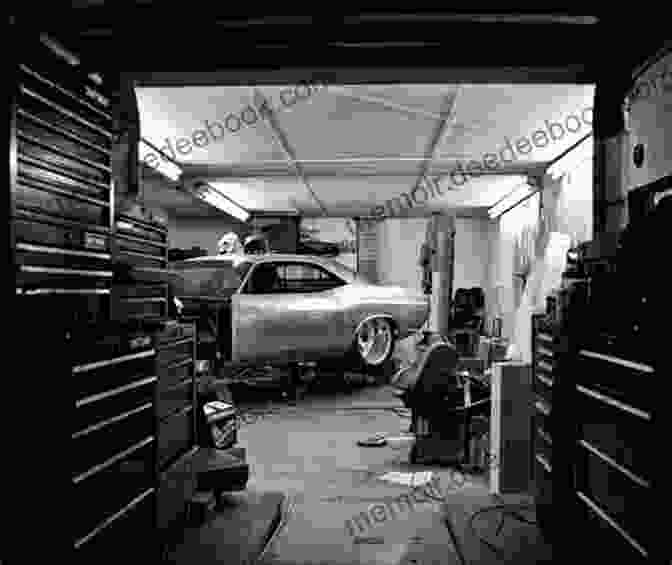 A Car Mechanic Working On A Classic Muscle Car In A 1970s Garage. Under The Bonnet: Confessions Of A 1970s And 80s Car Mechanic