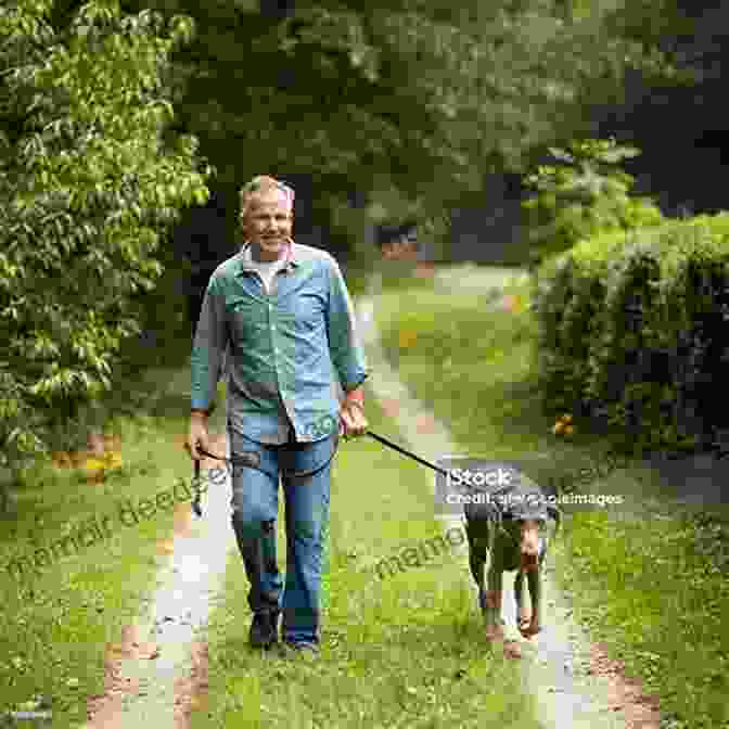 A Senior Man Walking With His Dog In A Park, Enjoying The Fresh Air And Sunshine The Best Days Are Dog Days